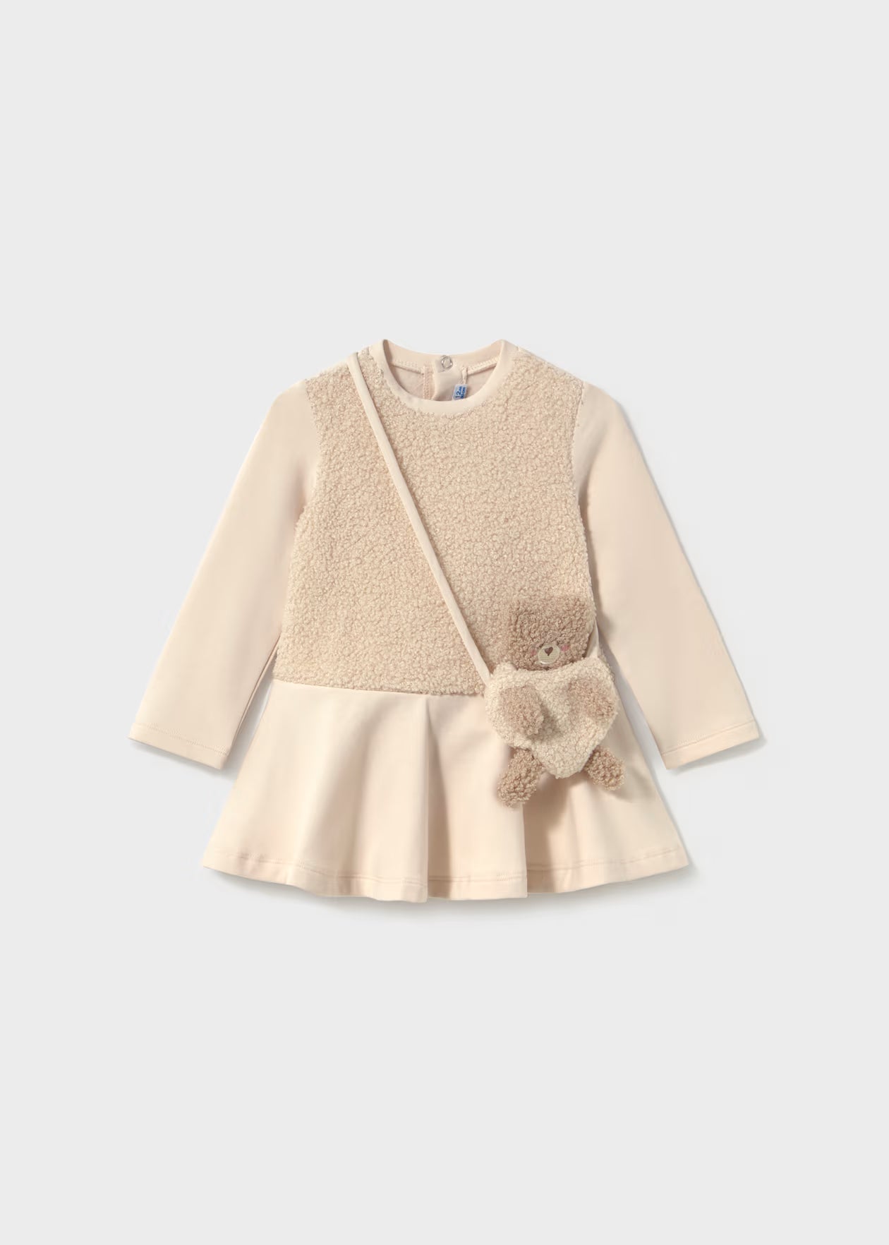 Dress paired with a baby bear handbag