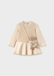 Dress paired with a baby bear handbag